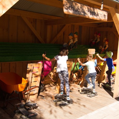 Our hardworking construction workers push the wheelbarrow very fast even in autumn